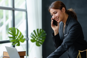 female Lawyer using laptop in office