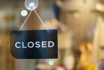 close signboard hanging outside Store