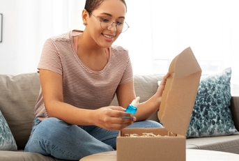 woman opening parcel box