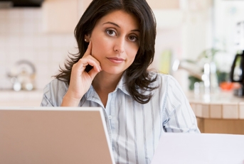 woman using laptop at home