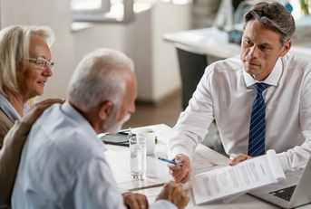 senior couple consulting bank manager