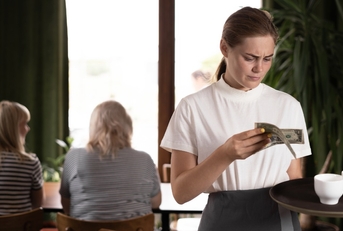 female waitress unhappy about tips received