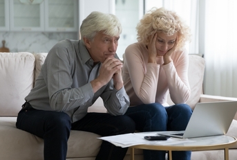 concerned mature husband and wife