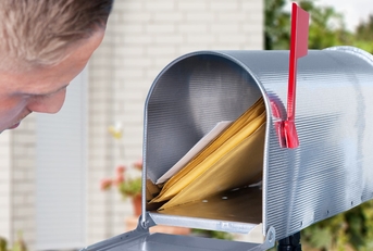 man checking mailbox for mails