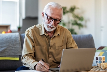 senior man reviewing investments plans