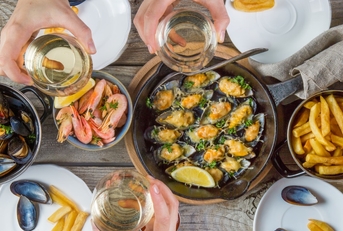 family having summer lunch with seafood