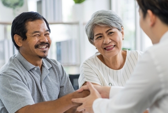 seniors talking to insurance staff