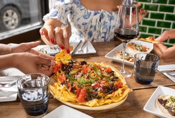 friends enjoying Mexican food 