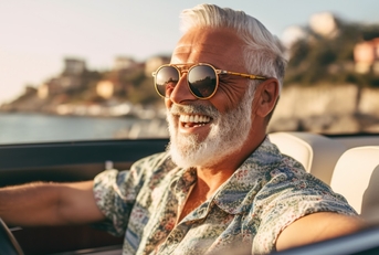 handsome senior man driving in italy