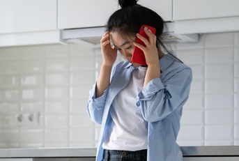 frustrated female making phone call