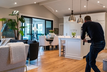 male Photographer filming real estate video