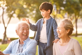 asian grandparents enjoying with grandson