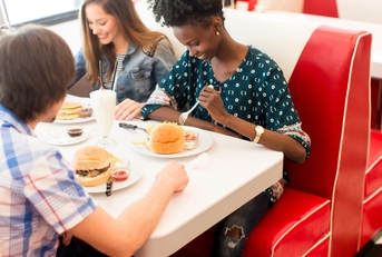 friends eating in diner