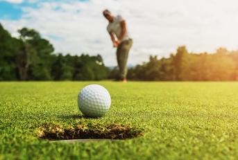 man playing golf at golf club