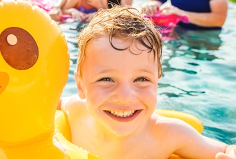 boy swimming in a pool