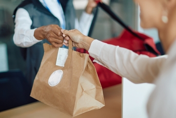 woman receives food delivery