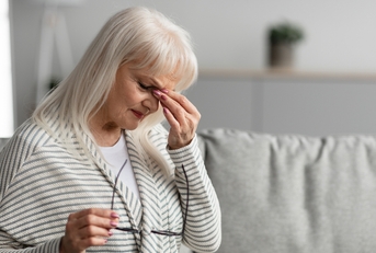 mature woman rubbing her eyes