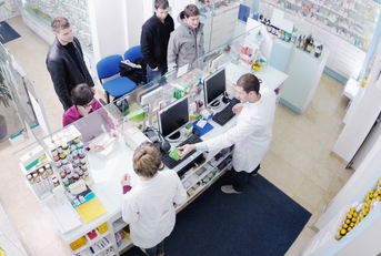 pharmacist suggesting medical drug to buyer