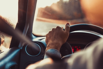 man driving car