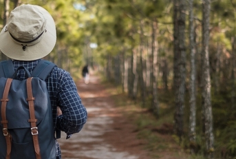 man with backpack hiking
