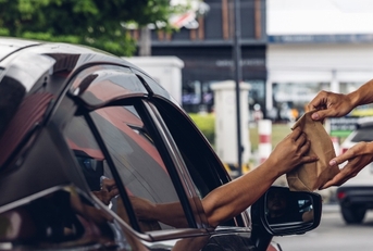 receiving coffee in drive thru 