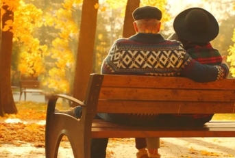 senior couple on park bench