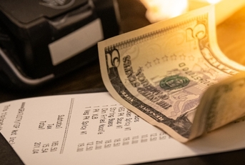 restaurant bill with tip