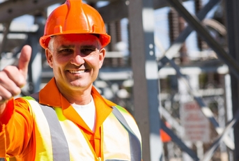 happy male electrician giving thumb up