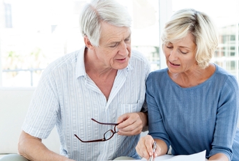 senior couple reviewing finances together