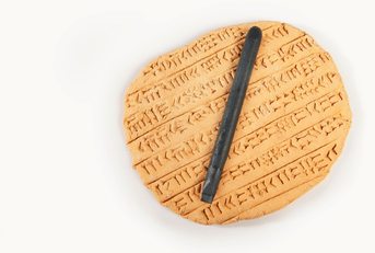 cuneiform clay tablet with stylus