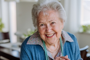 happy senior woman using smartphone