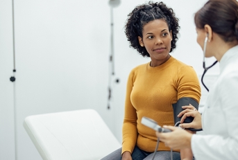 doctor measuring blood pressure