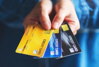 Woman showing credit cards