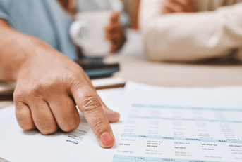 Senior hands looking at budget