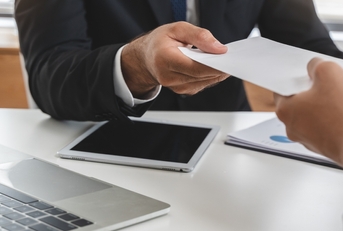 office worker receiving salary from boss