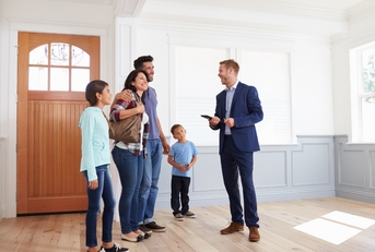 Realtor Showing Hispanic Family New Home
