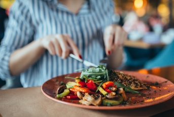 Woman in restaurant eating