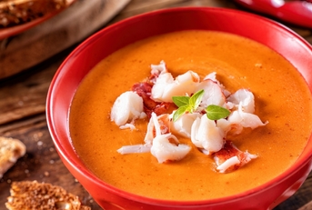 Creamy Lobster Bisque on wooden table