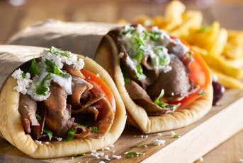 two greek gyros with shaved lamb 