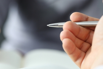 hands with pens