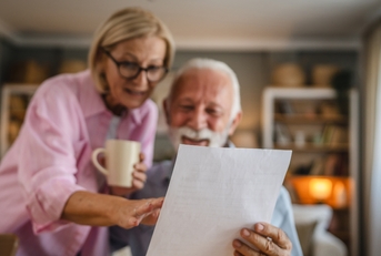 Couple reading a letter document