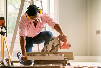 Contractor using sawing machine