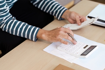Senior Calculating financial at Home