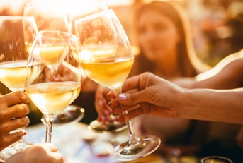 clinking glasses with wine