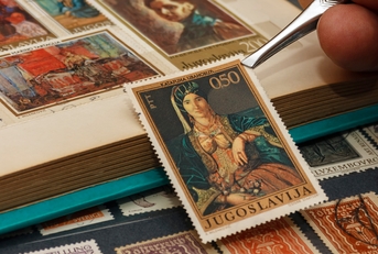 using tweezers above the stamp 