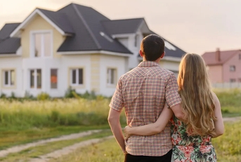 Couple looking at their new house