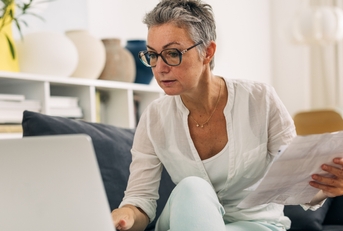 elderly woman doing taxes 
