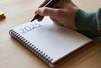 Hand writing 2025 New Year&#x27;s resolution concept
