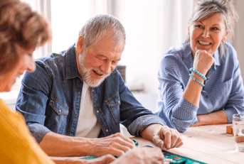 Senior people playing board games