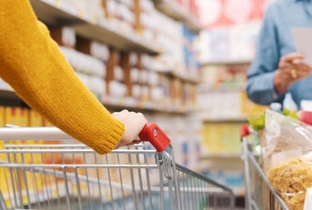 Customers doing grocery shopping at store